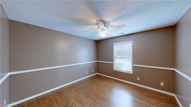 empty room featuring hardwood / wood-style floors, a textured ceiling, and ceiling fan