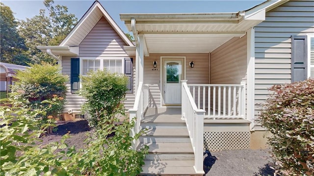 entrance to property featuring a porch