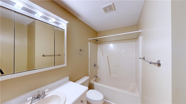 full bathroom featuring vanity, a textured ceiling, toilet, and shower / bathtub combination