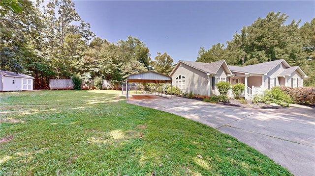 view of front of property with a front lawn, a carport, and a storage shed