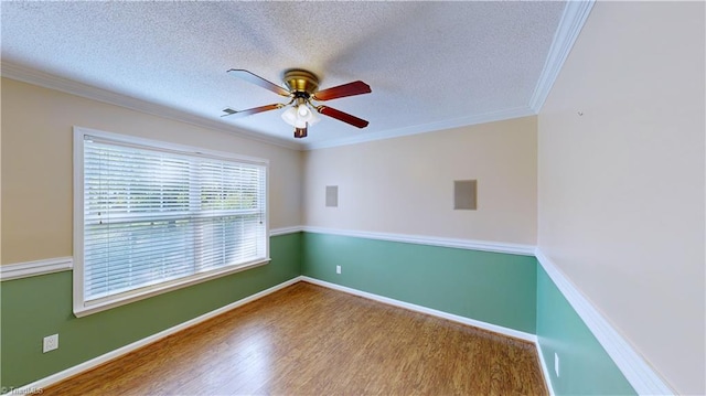 spare room featuring crown molding, ceiling fan, a textured ceiling, and hardwood / wood-style flooring