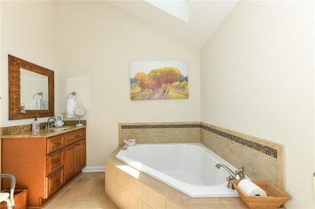8009 Willow Glen Trl, Greensboro, NC 27455 - bathroom featuring a skylight, a bath, vanity, lofted ceiling, and tile patterned flooring