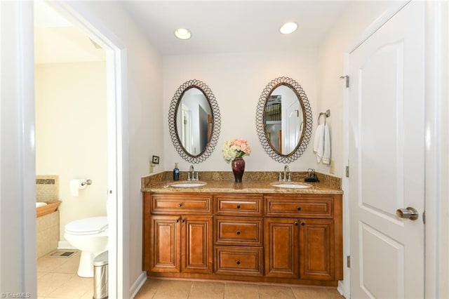 8009 Willow Glen Trl, Greensboro, NC 27455 - full bath featuring tile patterned flooring, toilet, double vanity, and recessed lighting