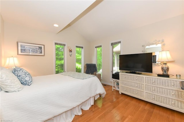 8009 Willow Glen Trl, Greensboro, NC 27455 - bedroom featuring multiple windows, vaulted ceiling, light wood finished floors, and recessed lighting