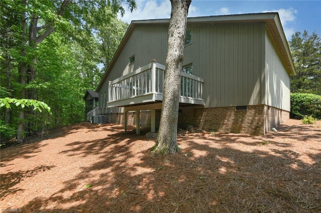 8009 Willow Glen Trl, Greensboro, NC 27455 - back of property with a deck, cooling unit, stairway, and crawl space