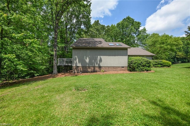8009 Willow Glen Trl, Greensboro, NC 27455 - view of side of property featuring crawl space, a yard, and a deck