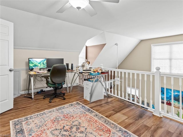 office area with ceiling fan, vaulted ceiling, plenty of natural light, and hardwood / wood-style floors