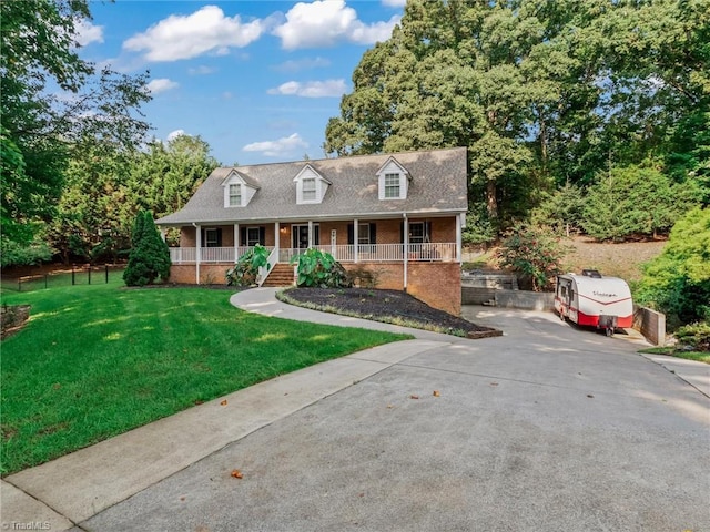 view of front facade with a front yard and a porch