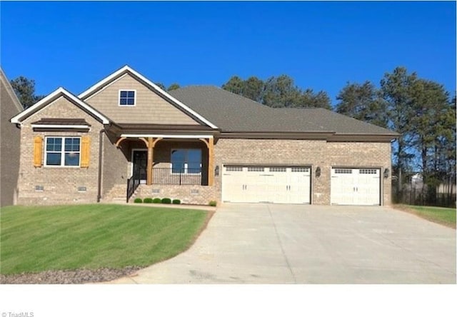 7888 Maple Pond Dr Lot 52, Oak Ridge, NC 27310 - view of front of house with a garage, driveway, brick siding, and a front lawn