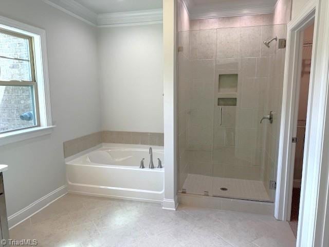 bathroom featuring a stall shower, ornamental molding, tile patterned floors, a garden tub, and vanity