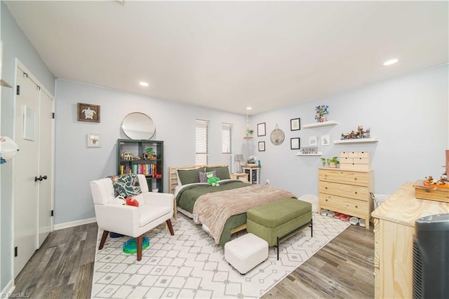 bedroom featuring wood finished floors and recessed lighting