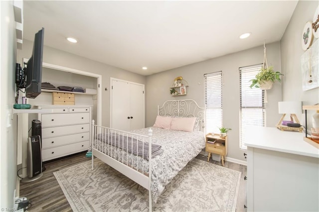 bedroom featuring dark wood finished floors, recessed lighting, and baseboards