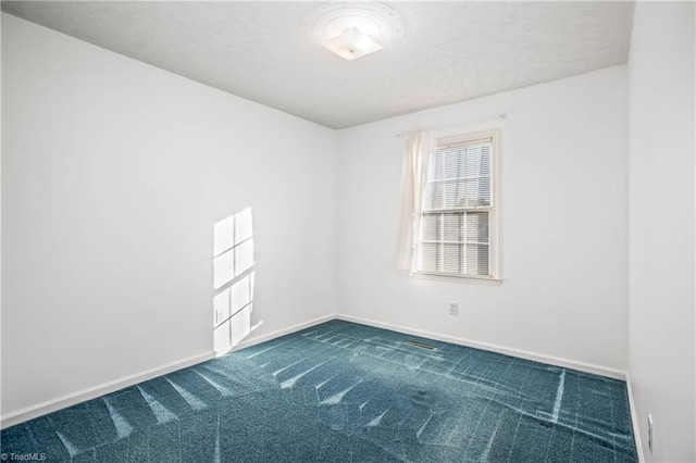 unfurnished room with carpet floors