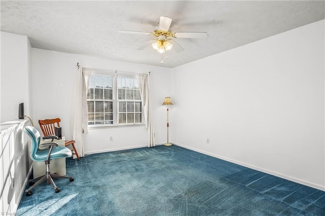 sitting room with carpet and ceiling fan