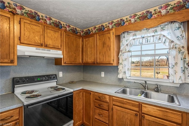 kitchen with electric range, sink, a textured ceiling, and tasteful backsplash