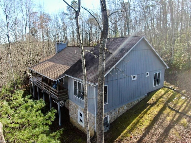 back of property featuring a wooden deck