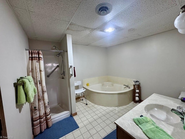 bathroom featuring vanity, separate shower and tub, and a paneled ceiling