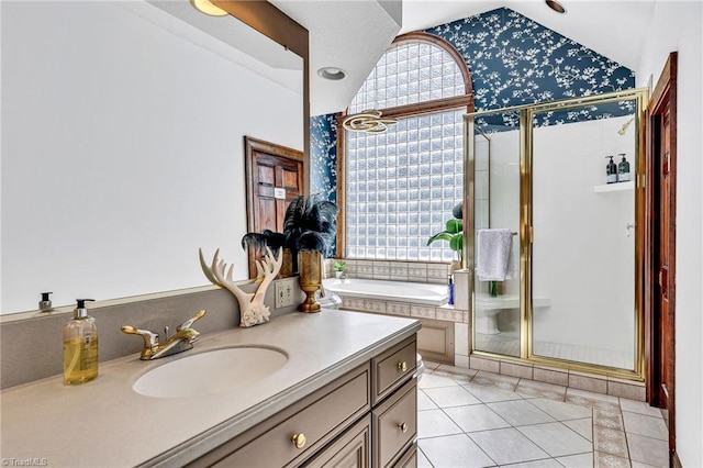 bathroom featuring tile patterned flooring, vanity, a wealth of natural light, and shower with separate bathtub