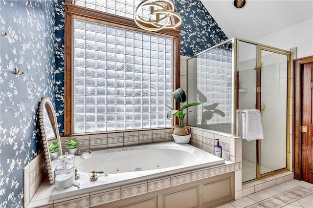 bathroom with tile patterned flooring, independent shower and bath, and a healthy amount of sunlight