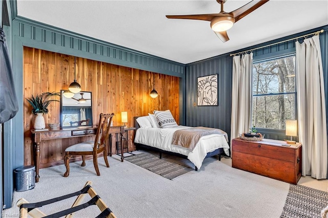 carpeted bedroom with multiple windows and ceiling fan