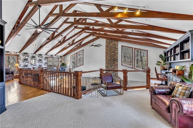 living room with beam ceiling, high vaulted ceiling, and ceiling fan