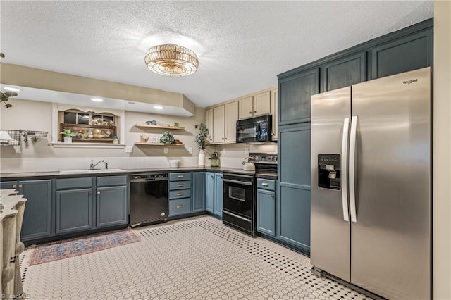 kitchen with sink, black appliances, and a textured ceiling