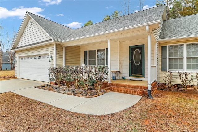 ranch-style house featuring a garage and covered porch