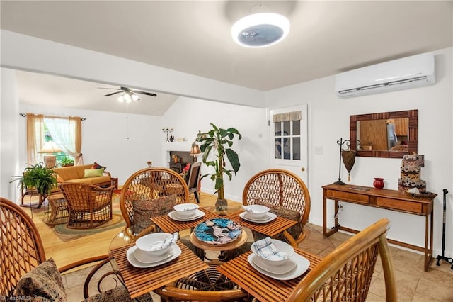 206 Westwood Dr, Kernersville, NC 27284 - dining space featuring a ceiling fan, baseboards, light tile patterned flooring, and an AC wall unit