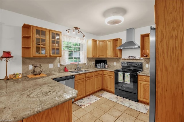 206 Westwood Dr, Kernersville, NC 27284 - kitchen featuring a sink, stainless steel appliances, light stone countertops, wall chimney range hood, and tasteful backsplash