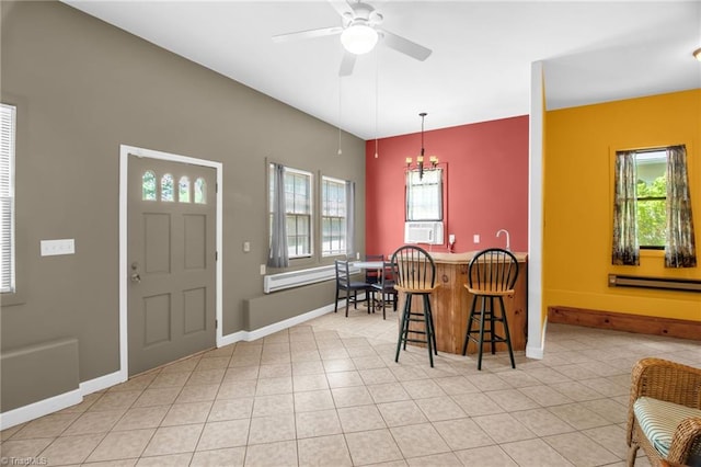 206 Westwood Dr, Kernersville, NC 27284 - dining space featuring baseboards, a baseboard heating unit, cooling unit, light tile patterned floors, and ceiling fan