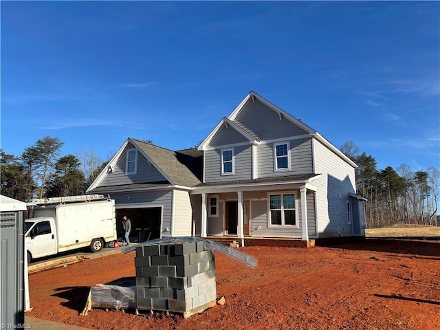 view of front of house featuring a garage and covered porch