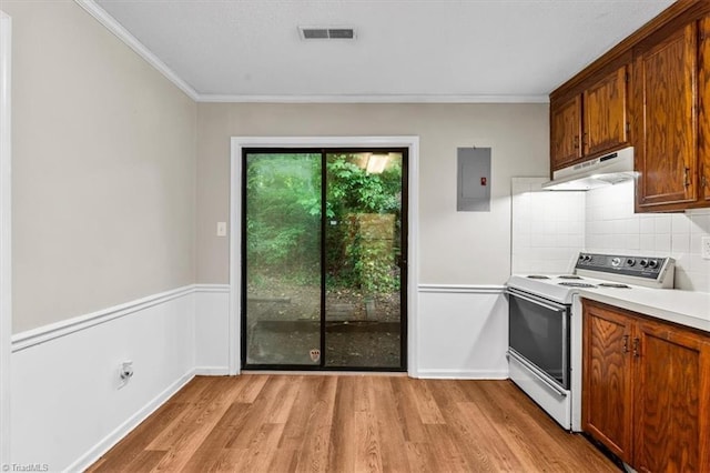 kitchen with white electric stove, light wood-style floors, electric panel, ventilation hood, and visible vents