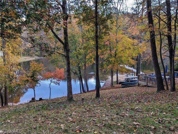 water view featuring a wooded view