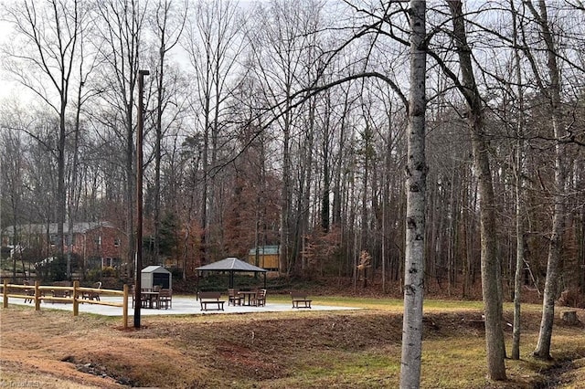 view of yard featuring fence and a gazebo