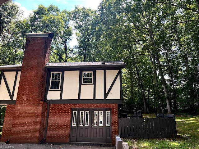 view of outdoor structure with fence