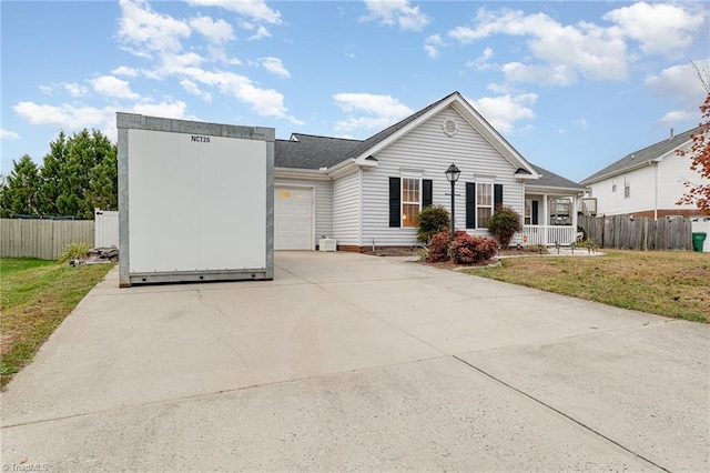 ranch-style home with a front lawn, a porch, and a garage