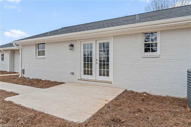 entrance to property with a patio area and french doors