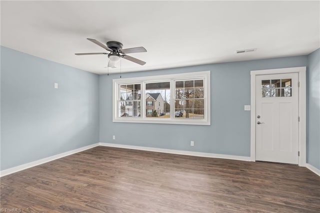 interior space featuring ceiling fan and dark wood-type flooring