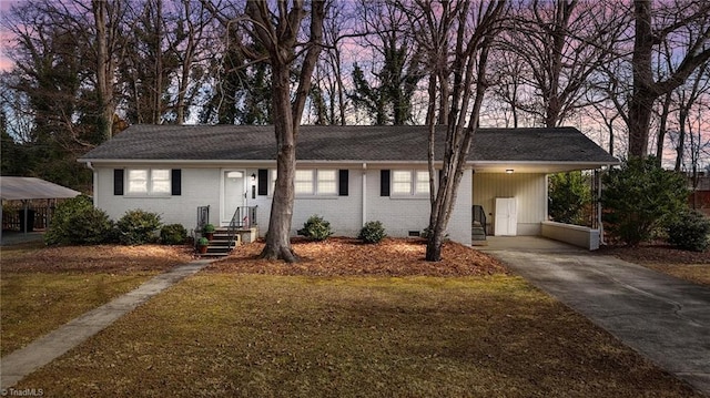 single story home with a carport and a yard