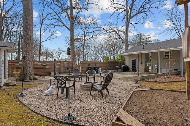 view of yard featuring a patio area and a fire pit