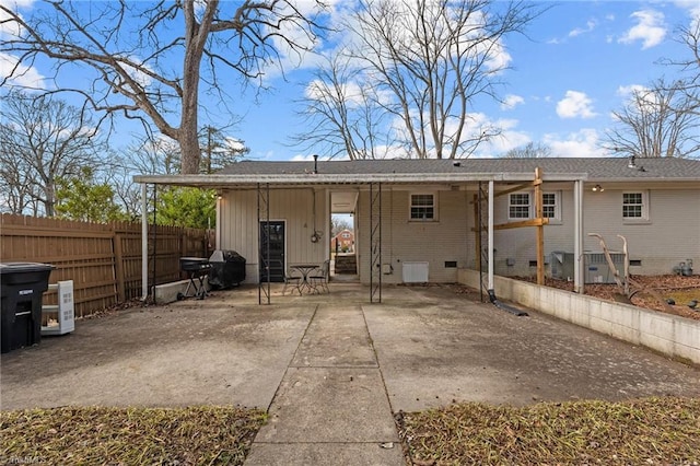 rear view of property featuring a patio area