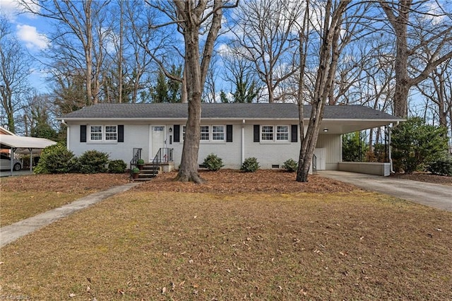 ranch-style home featuring a carport