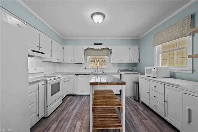 kitchen with white cabinetry, white appliances, ornamental molding, and washing machine and dryer