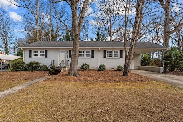 ranch-style house featuring a carport