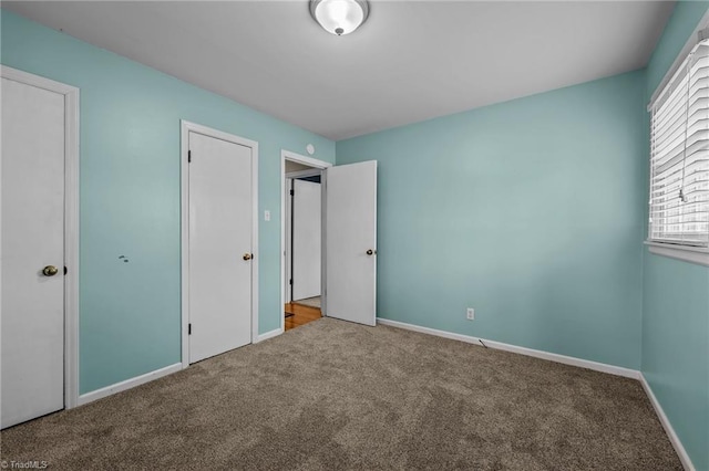 unfurnished bedroom with carpet flooring