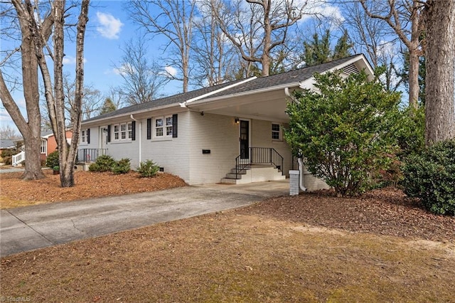 ranch-style home with a carport