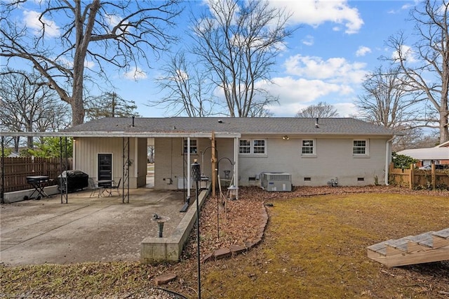 back of property featuring cooling unit and a patio