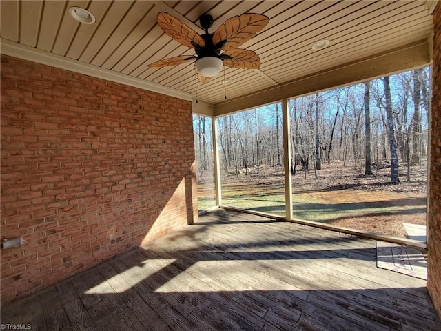 wooden deck with a ceiling fan