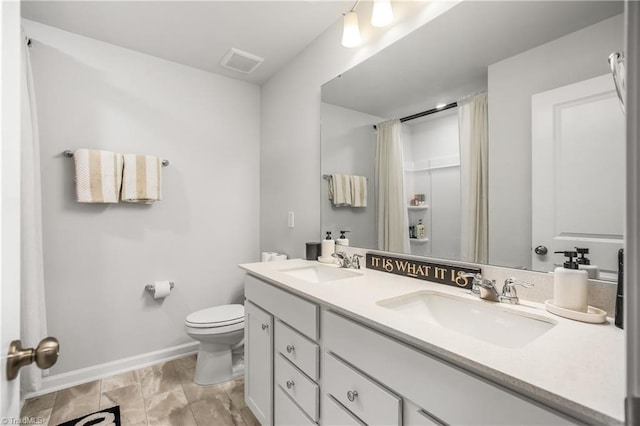 bathroom with vanity and toilet