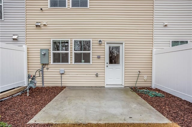 property entrance featuring a patio